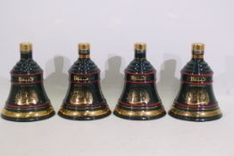 Bells - Four Wade decanters, with conten