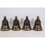 Bells - Four Wade decanters, with conten