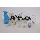 A lot including a Chinese blue mounted Fu dog. 3 x Chinese ceramic pandas.