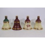 Bells - Four Wade decanters, with conten