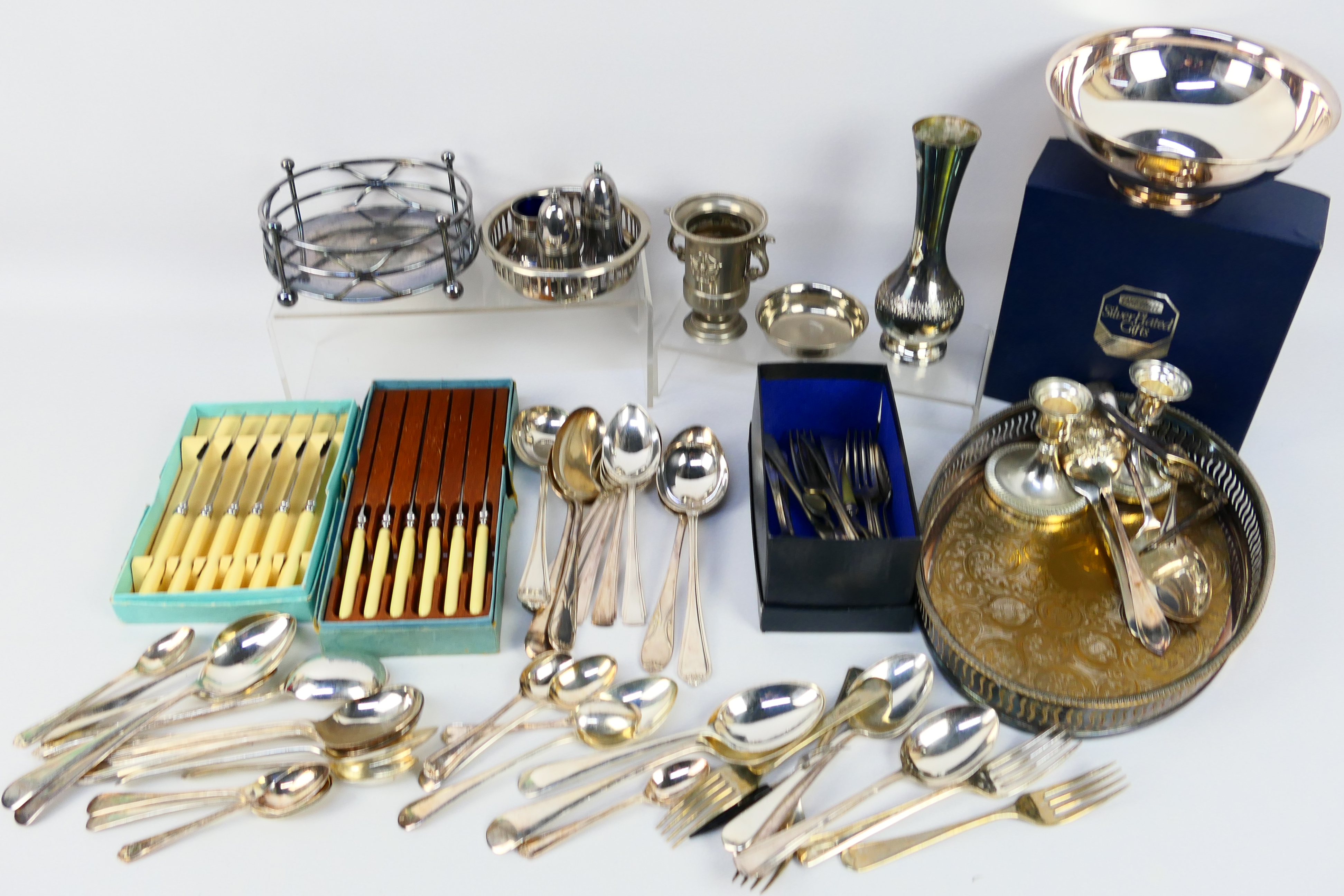 A collection of various plated ware, stainless and other including flatware.