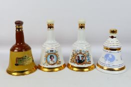 Bells - Four Wade decanters, with conten