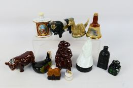 A group of miniature novelty decanters i