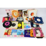 A collection of 7" vinyl records to include Duran Duran, Motown, Suzi Quatro, The Shamen,