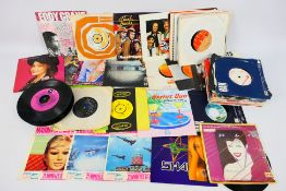 A collection of 7" vinyl records to include Duran Duran, Motown, Suzi Quatro, The Shamen,