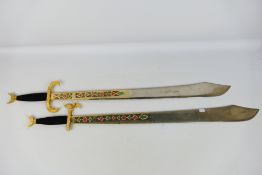 A pair of decorative wall hanging swords, approximately 100 cm (l). [2].