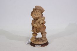 Giuseppe Armani - An Italian Gulliver's World 'Boy Holding Fish' figure - 22 cm (h).