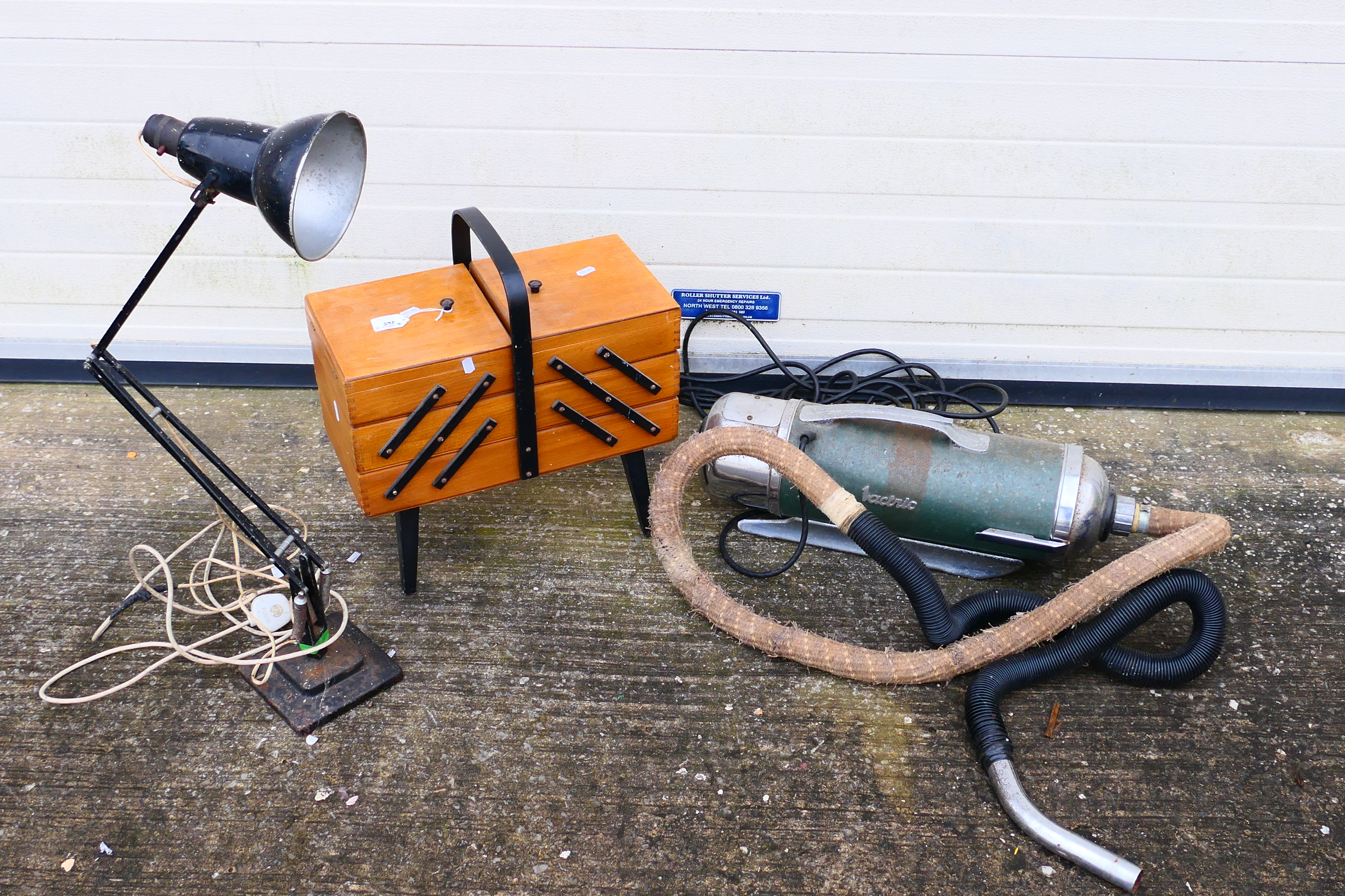 A vintage Vactric vacuum cleaner, an Anglepoise style lamp and a sewing box. [2].