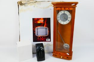 Lot to include a Widdop wall clock, boxed mini heater and a folding fire guard. [2].