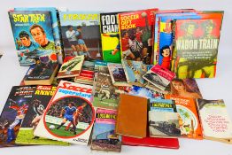 A collection of vintage annuals relating to football, locomotives, Star Trek, and similar.
