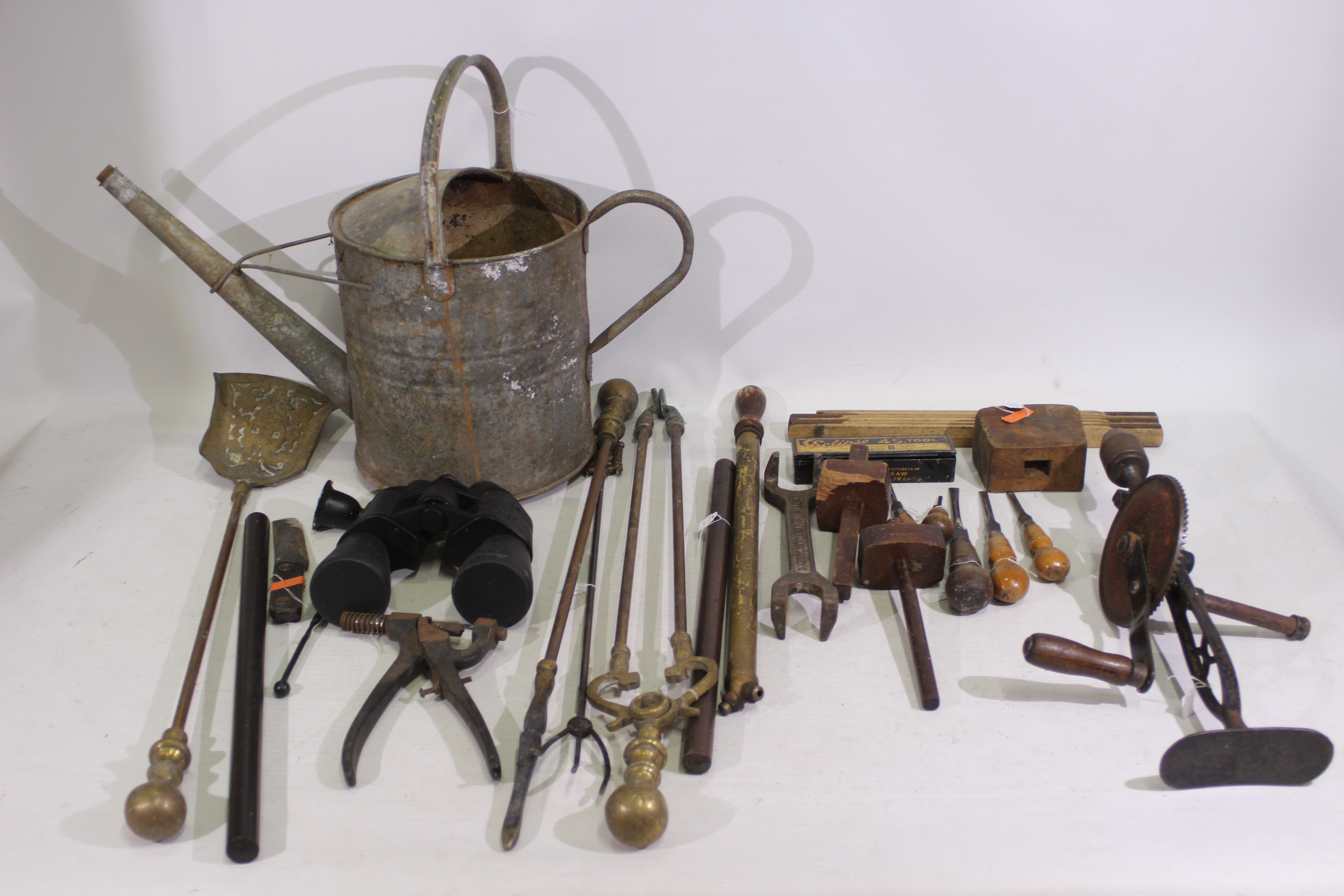 A collection of vintage tools and brassw