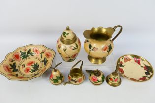 A brass Indian set with floral decoratio