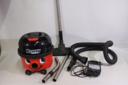 A Henry Hoover Vacuum Cleaner. Appears u