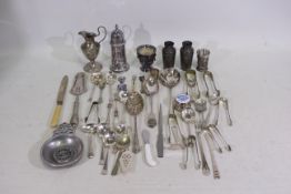 A collection of predominantly silver pla