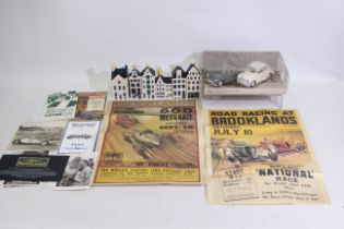 Lot to include a small collection of racing car advertisement posters and including Brooklands 5th