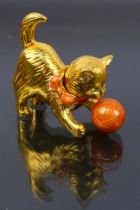 Estee Lauder - A boxed gilt metal Estee Lauder solid perfume compact in the form of a cat.