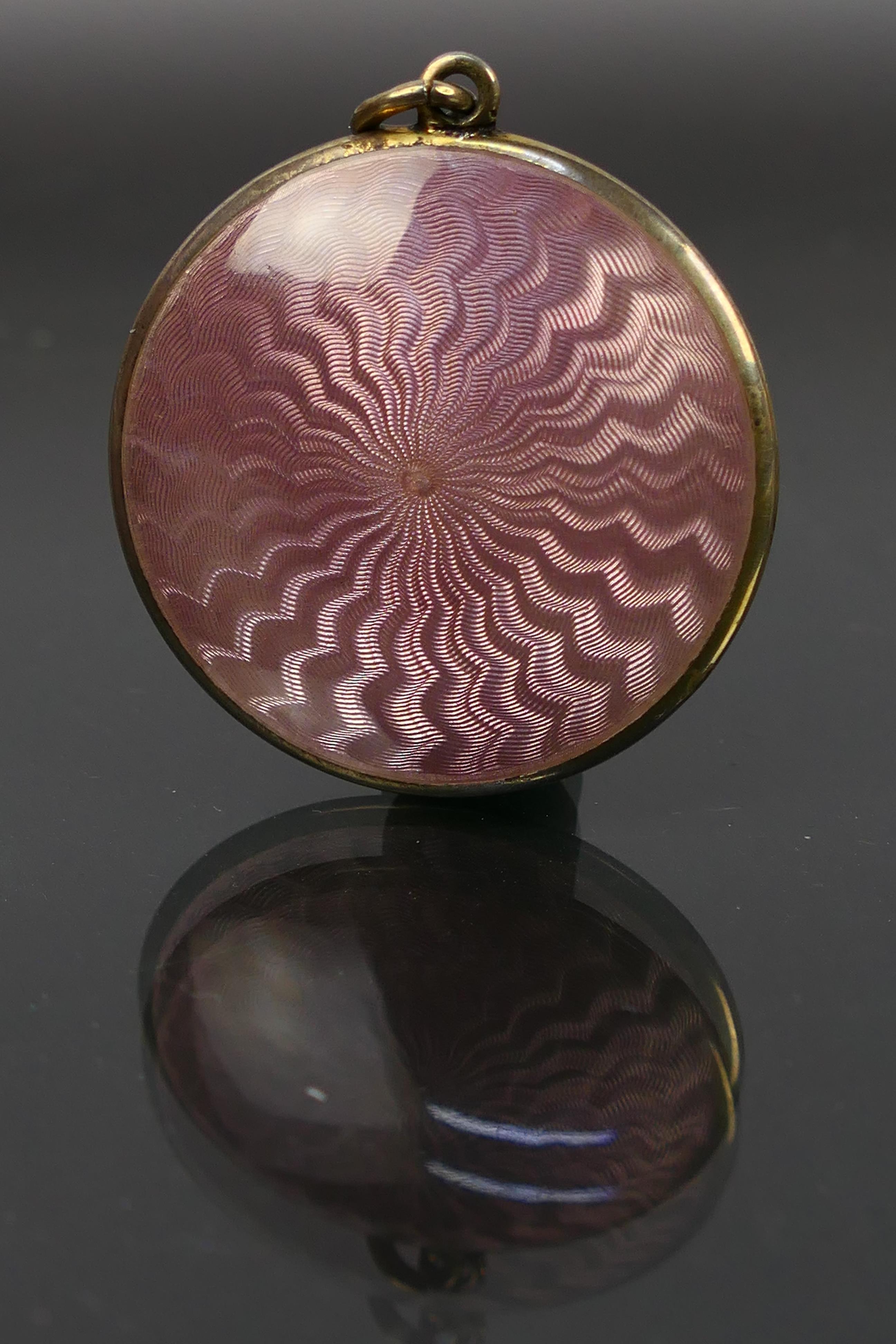 A miniature guilloche enamel powder compact, covered front and back in pale pink enamel. - Image 3 of 6