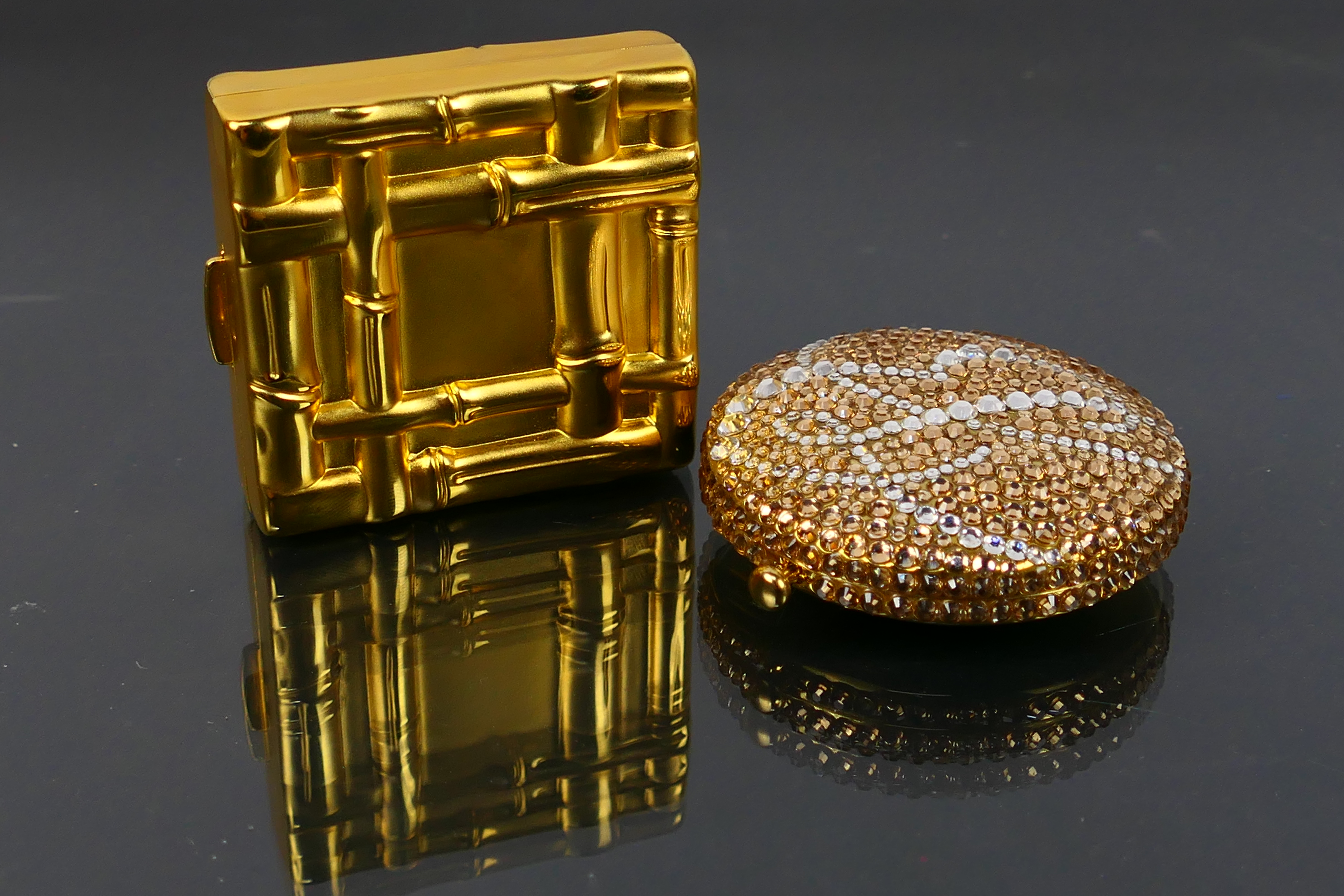 Estee Lauder - 2 x boxed gilt metal Estee Lauder powder compacts - Lot includes a Bamboo Weave