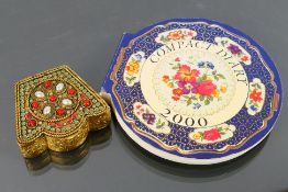 A vintage gilt metal, beautifully patterned powder compact.