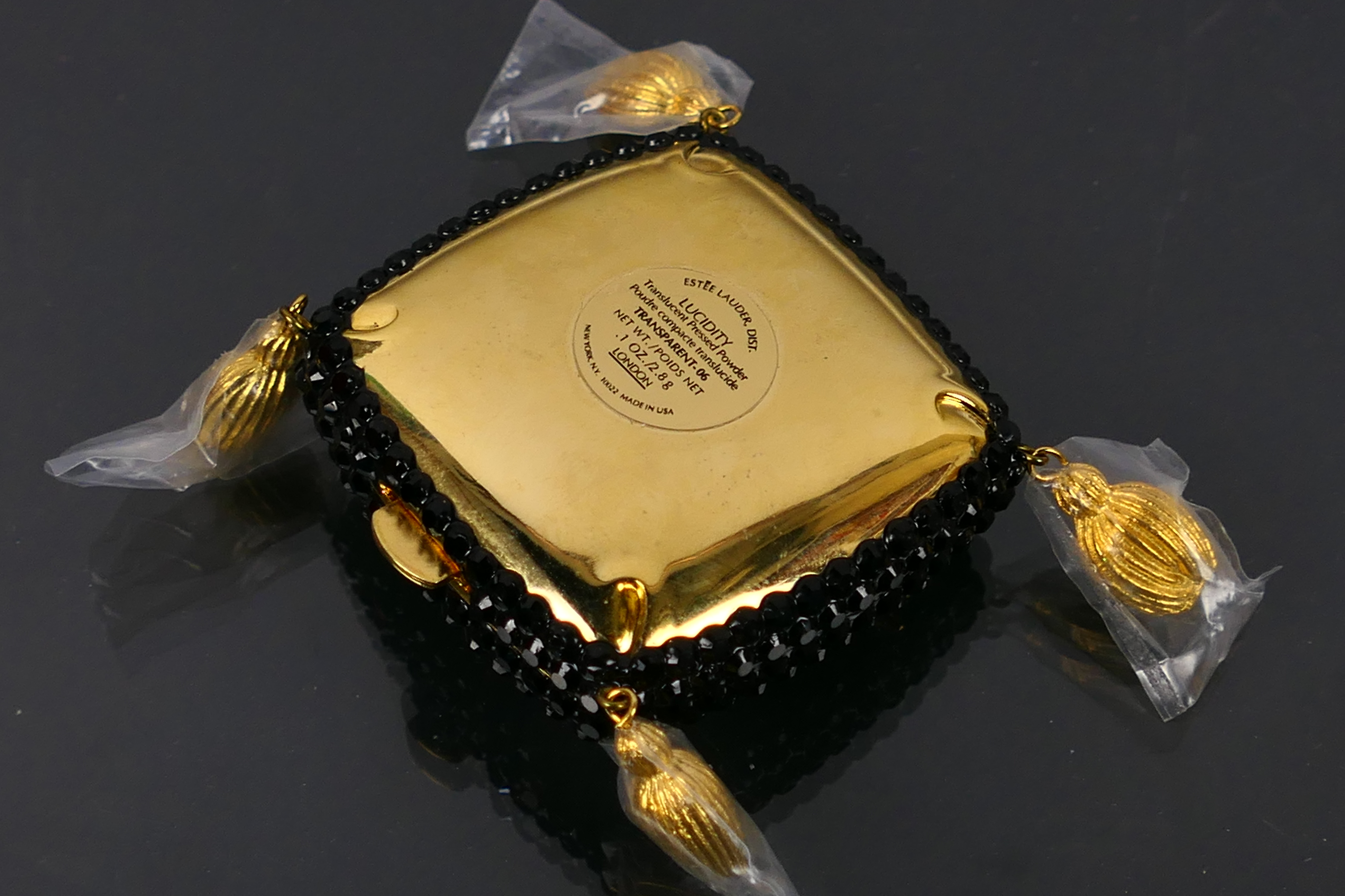 Estee Lauder - A boxed gilt metal Estee Lauder Sophisticated Lady Heel powder compact. - Image 5 of 7