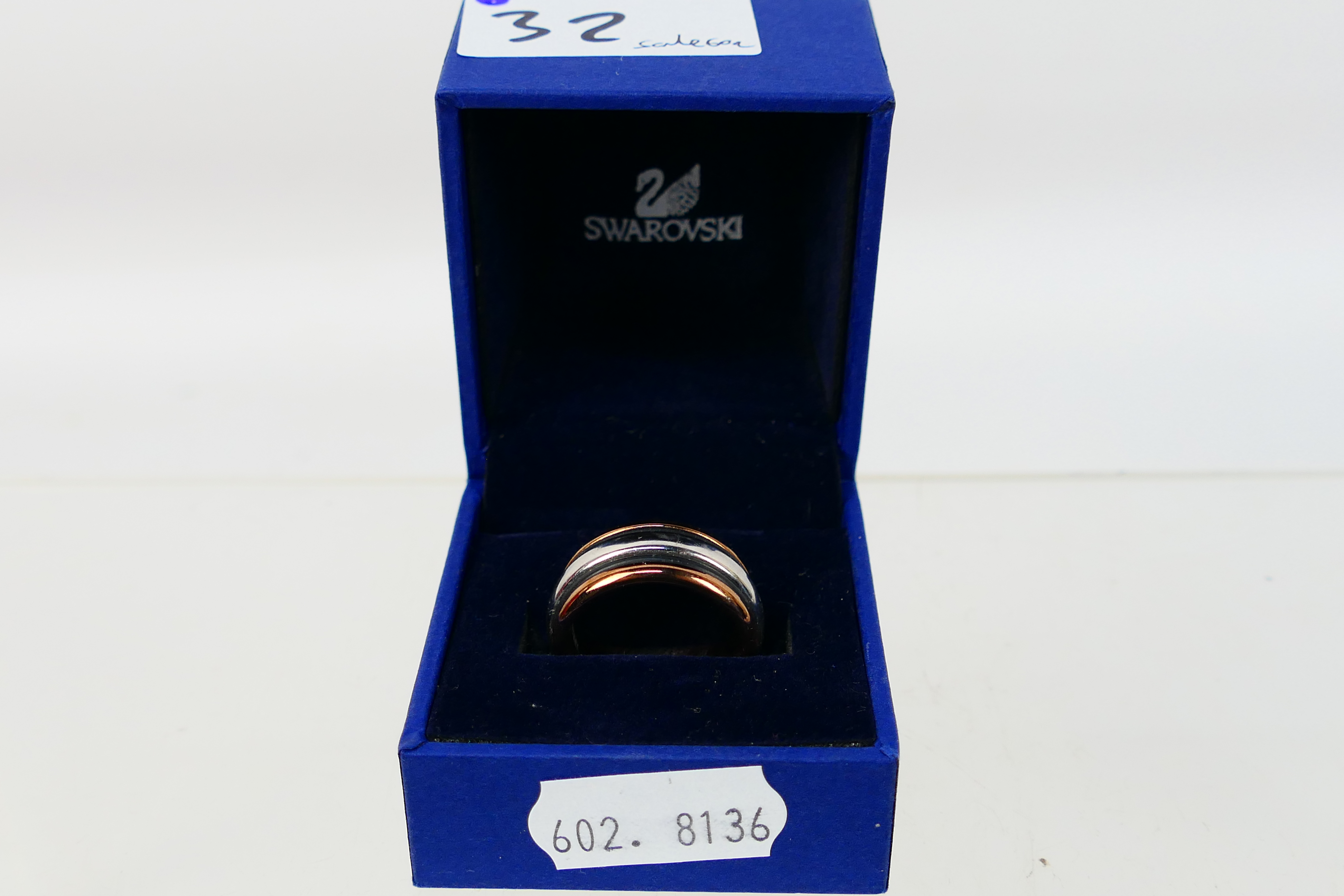 Swarovski, Elixa - A stainless steel Elixa rose gold coloured ring within a Swarovski box. - Image 4 of 4