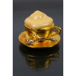 Estee Lauder - A boxed gilt metal Estee Lauder Beautiful Cafe Cup solid perfume compact.