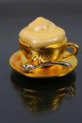 Estee Lauder - A boxed gilt metal Estee Lauder Beautiful Cafe Cup solid perfume compact.