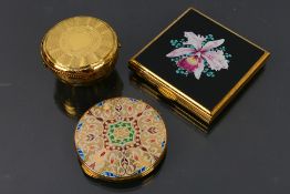 Kigu - 3 x vintage compacts, a circular model with a colourful lid design in a pouch,