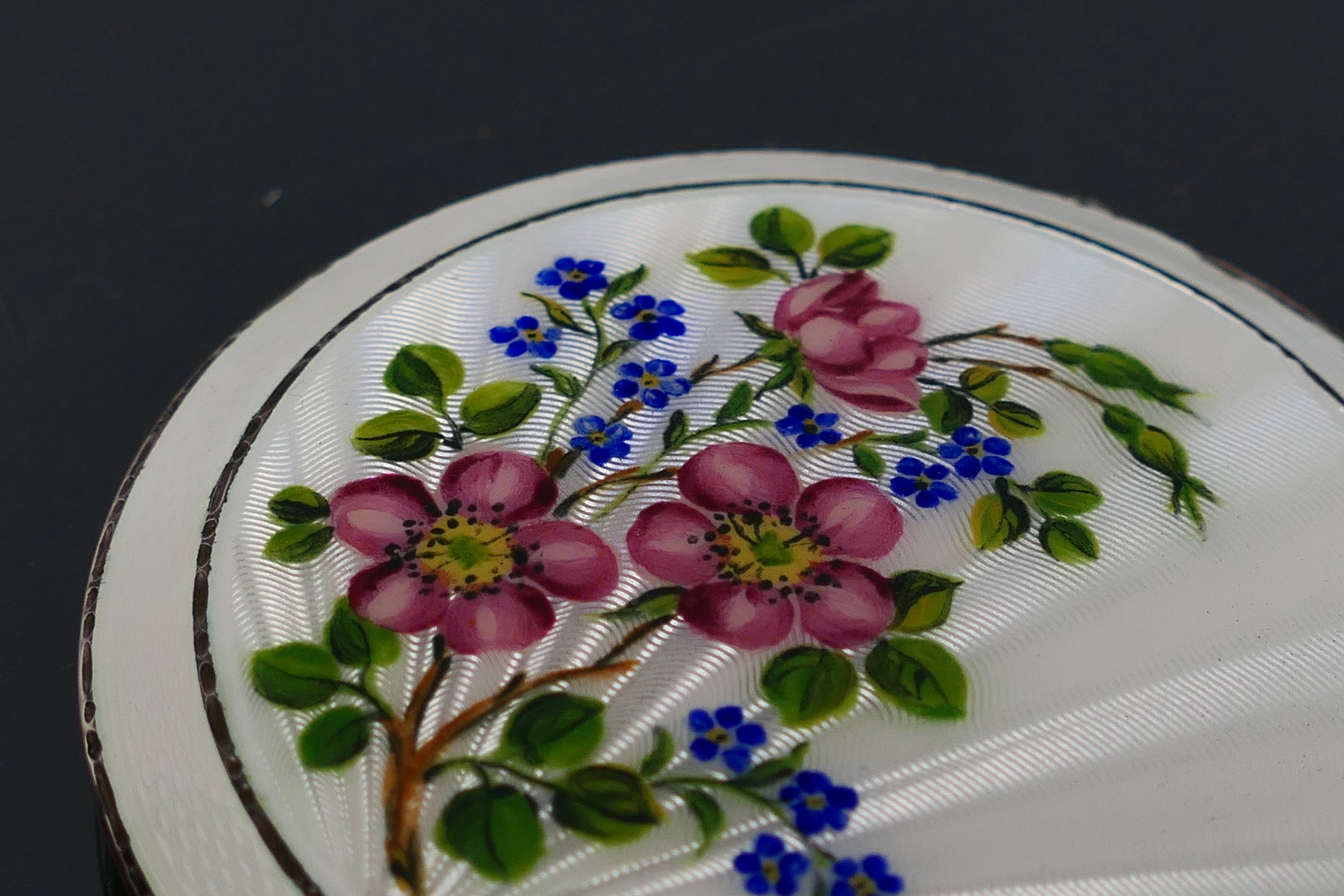 Henry Clifford Davis - A guilloche enameled powder compact with a floral display on the white - Image 4 of 10