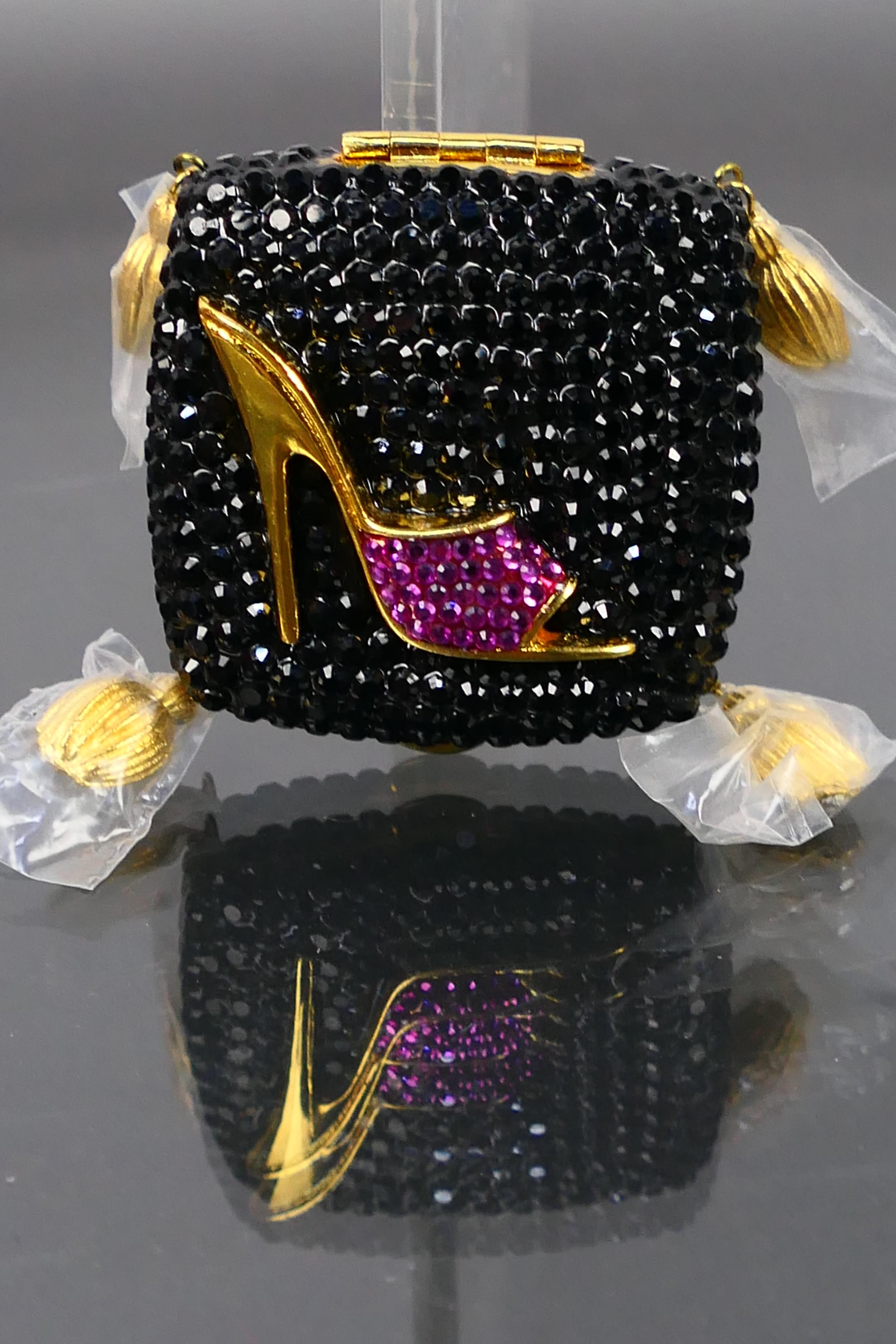 Estee Lauder - A boxed gilt metal Estee Lauder Sophisticated Lady Heel powder compact.