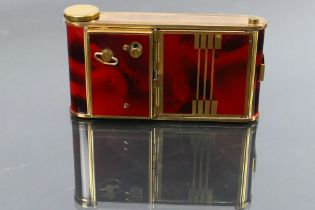 An art deco style German made musical compact, lipstick and cigarette case in the form of a camera.