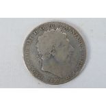 A George III silver crown, 1819. [W]