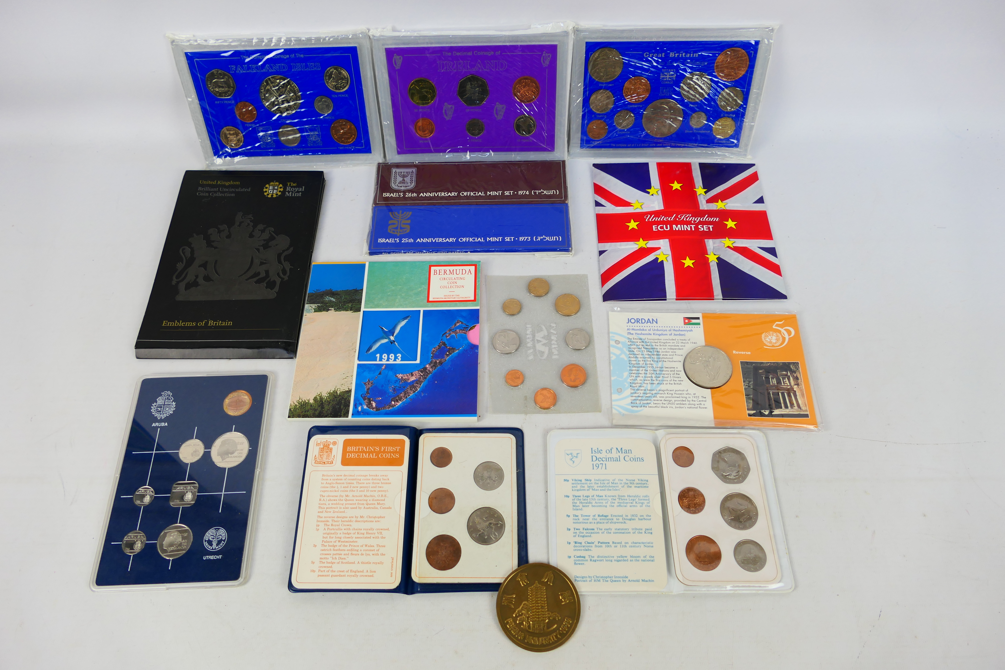 A collection of coin sets and similar to