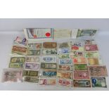 A collection of foreign banknotes and st