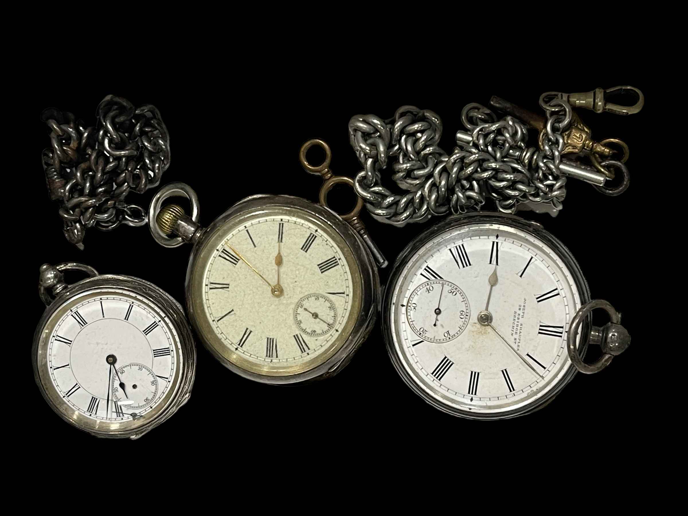 Three silver pocket watches.