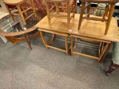 Rectangular nest of three teak tables and circular teak inset glass top coffee table.