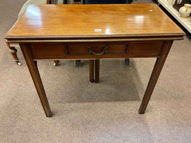 19th Century mahogany and chequer inlaid fold top tea table having frieze drawer and on square