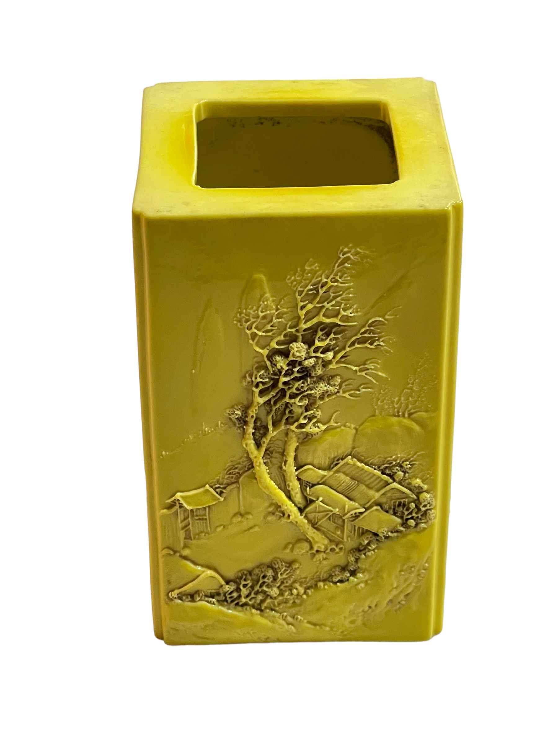 Chinese yellow ground square form brush pot decorated with raised tree and village and verse scenes,