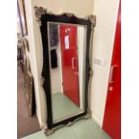 Rectangular black and silvered framed bevelled wall mirror, 183cm by 90cm including frame.