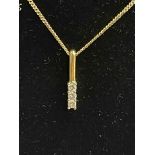 Diamond three stone 18 carat gold pendant with 9 carat gold chain.
