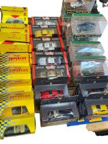Collection of boxed model vehicles including Shell Classic Sportscar, and Collezione,