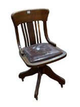 Early 20th Century oak swivel desk chair.