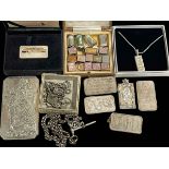 Collection of silver including ingots, charms, two alberts and tablets.