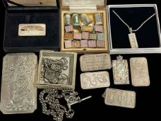 Collection of silver including ingots, charms, two alberts and tablets.