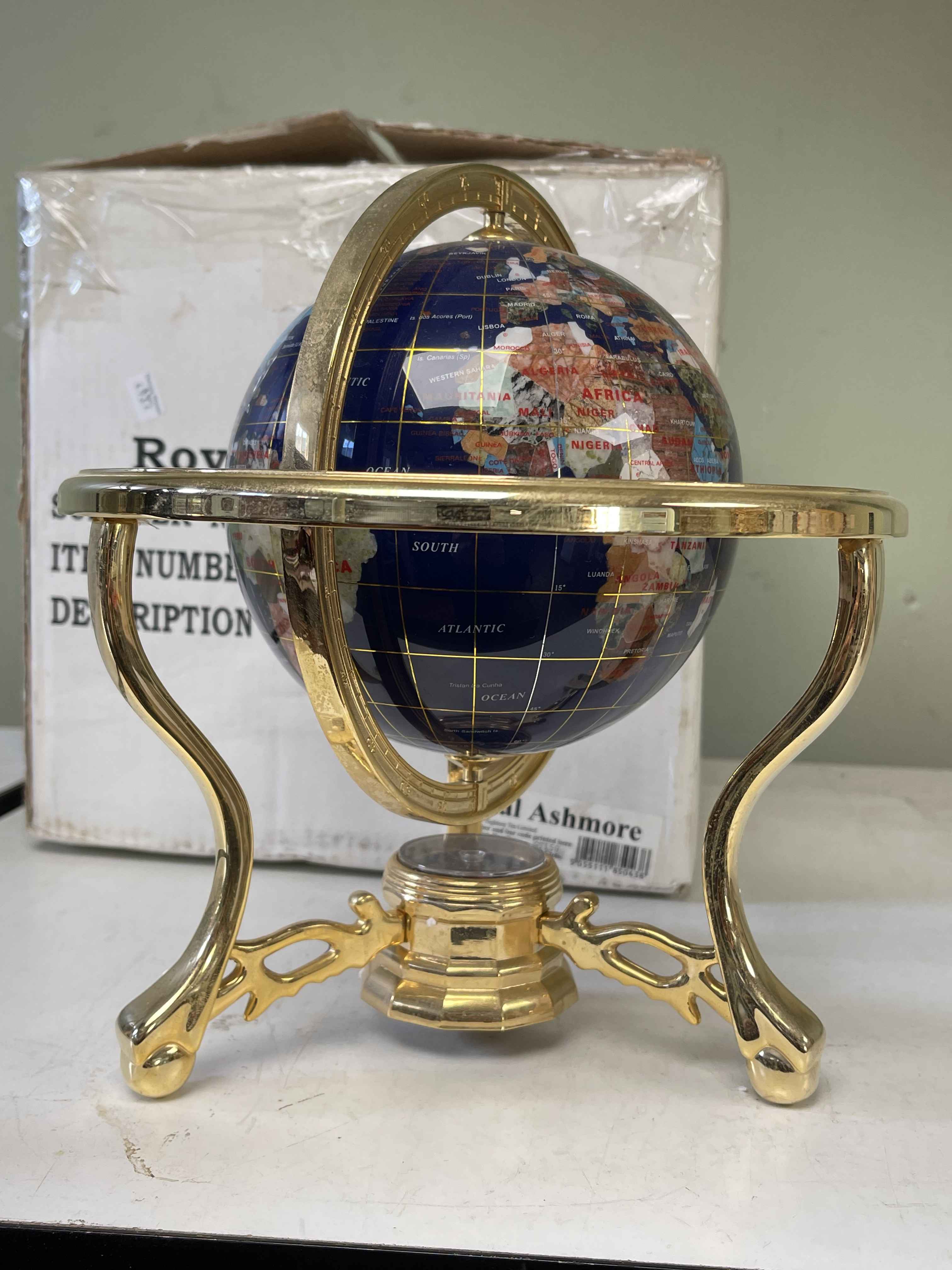 Small semi-precious stone globe on brass stand, boxed.