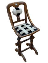 Late 19th/early 20th Century spring action adjustable music chair.