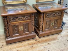 Pair Oriental carved hardwood two door pedestal cabinets, 66cm by 61cm by 45.5cm.