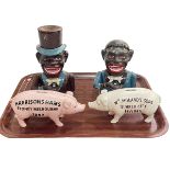 Four novelty money boxes including two Jolly Boy bank, Wm Moland's & Son and Harrison Hams.