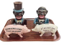 Four novelty money boxes including two Jolly Boy bank, Wm Moland's & Son and Harrison Hams.