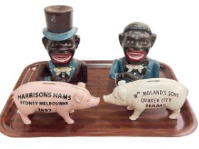 Four novelty money boxes including two Jolly Boy bank, Wm Moland's & Son and Harrison Hams.